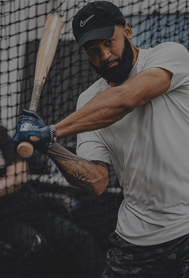 baseball player taking batting practice