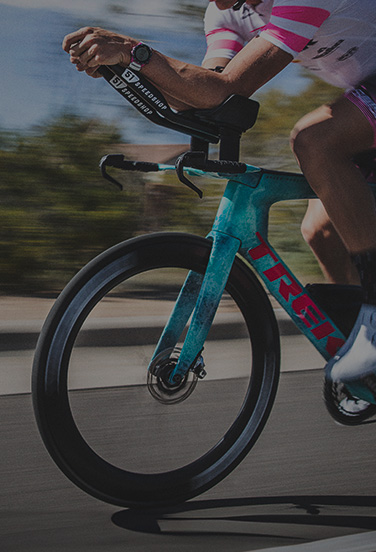 Cycler riding down a road