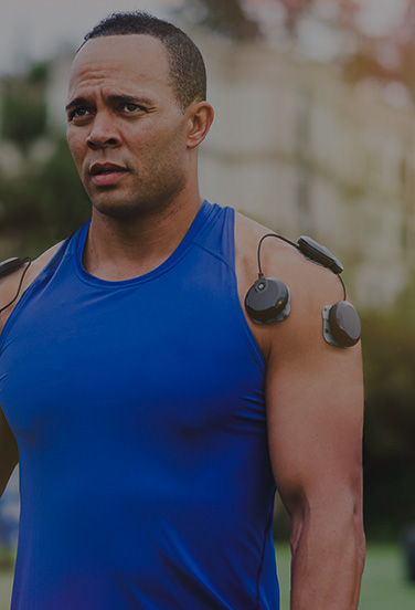 football player using muscle stimulator
