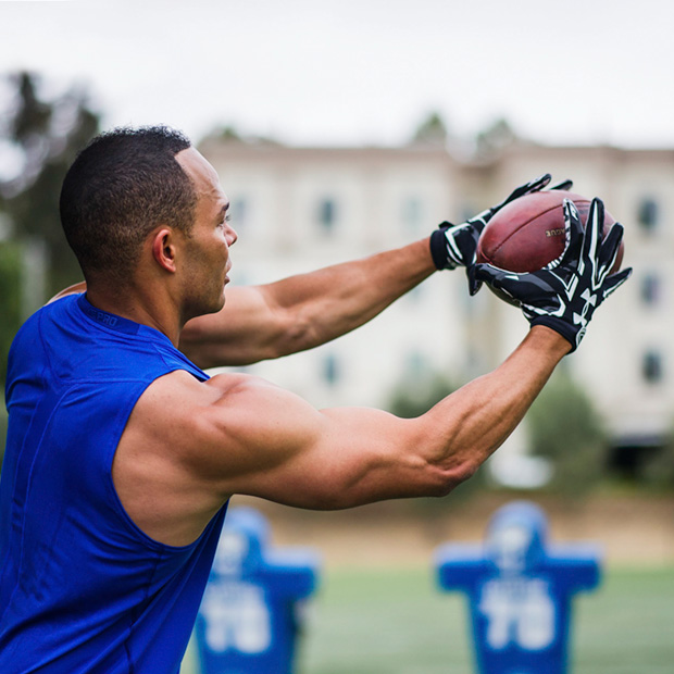 football player catching a football