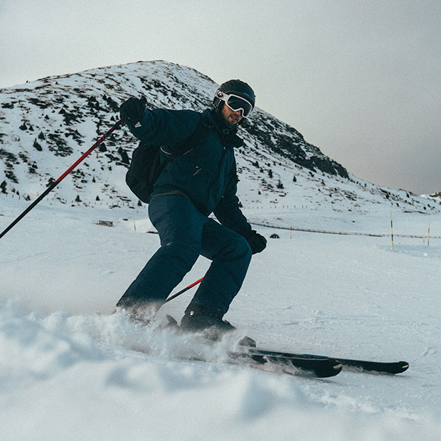 male skier headed down the hill